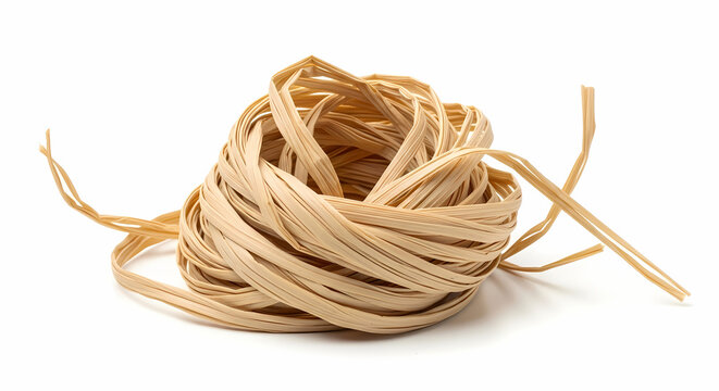 A close-up shot of a neatly coiled ball of natural beige raffia ribbon, isolated on a clean white background.