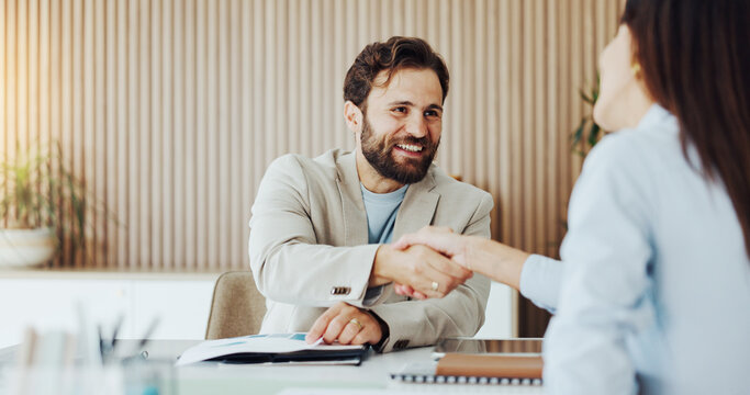 Happy, business people and agreement with handshake for partnership, introduction or hiring in office. Businessman, woman or colleagues shaking hands with smile for b2b, meeting or job recruiting