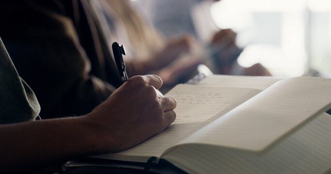Person, hands and writing with book in meeting for business schedule, minutes or agenda in workshop. Employee, group or taking notes with notebook for project reminder, tasks or presentation outcome