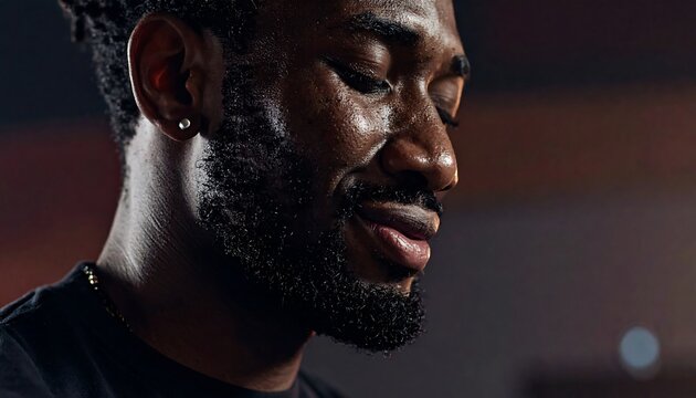 A close-up of a man with a beard and mustache