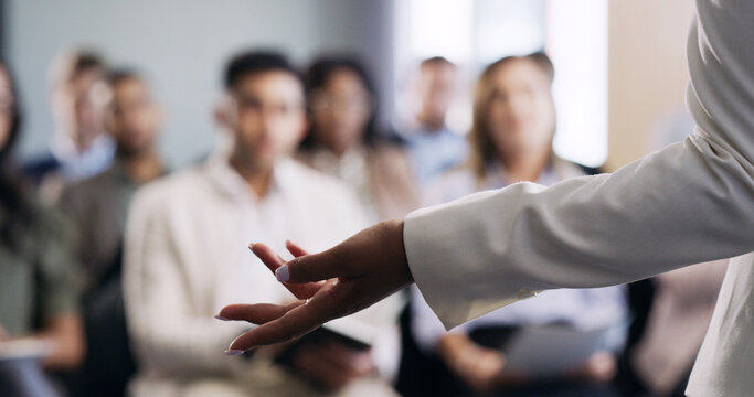 Business, speaker and hand with audience for presentation, seminar or company workshop. Person, coach or meeting with team discussion or question for tradeshow, conference or convention in workplace