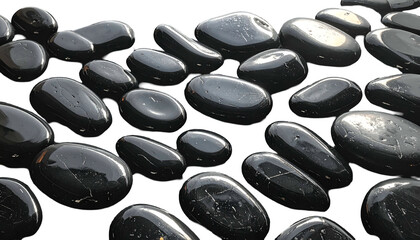 Smooth, glossy black river rocks arranged across a dark background, some light reflecting