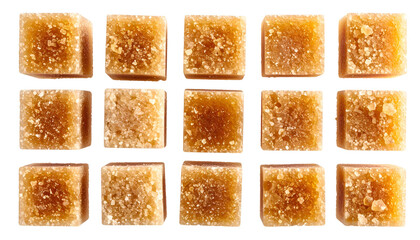 Close-up of fifteen light-brown sugar cubes arranged in three rows on a black backdrop