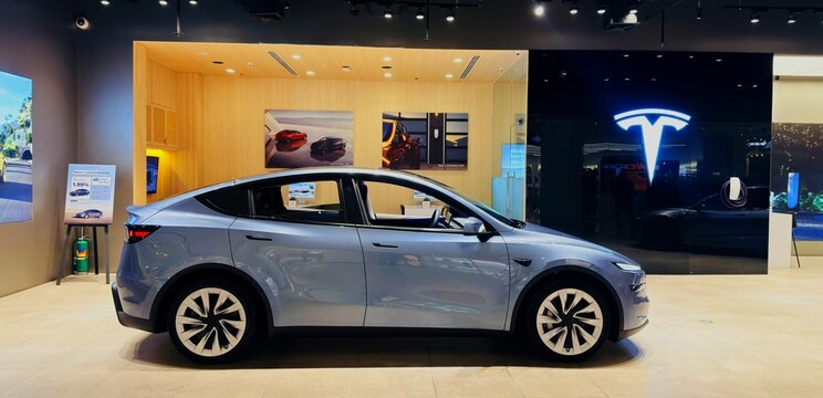 BANGKOK ,THAILAND , February 25, 2026 : Tesla model Y Futuristic car, display in showroom at siam paragon department store
