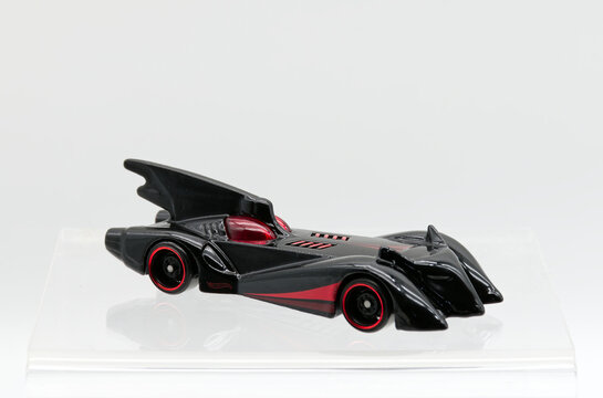 Bologna - Italy - February 10, 2026: Batmobile from Batman the brave and the bold die-cast model by Hot Wheels isolated on white background. Left side view.