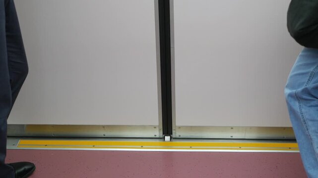 low angle view to skytrain subway door from inside the train commuter while train door is closing ready departing from station.Japan train transportation in metopolis of Tokyo