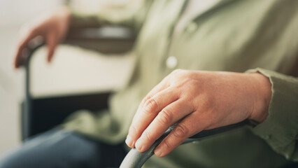 Fototapeta premium Elderly patient who has difficulty walking and uses a wheelchair