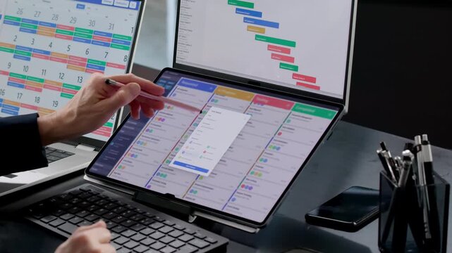 Woman Managing Project Schedule On Laptop With Kanban Software Program
