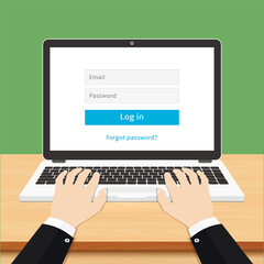 Login form on laptop computer screen. Hands typing login and password on laptop