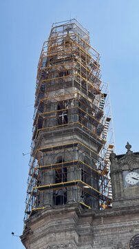 Tepic cathedral tower under reconstruction, scaffolding on church