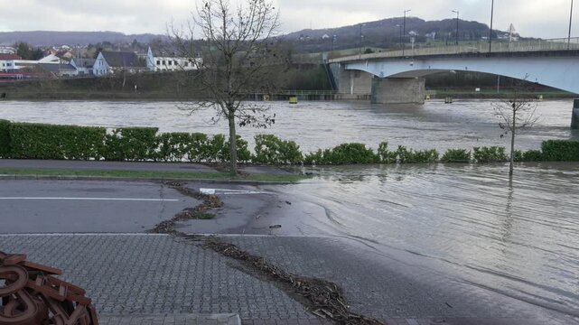 Flash flood of river Moselle banks overflow street of Luxembourg Europe