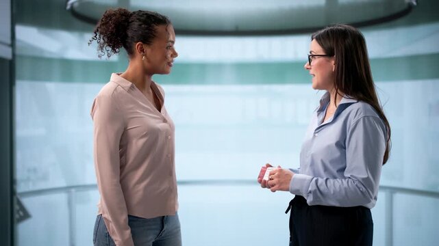 Woman Giving Visiting Card After Elevator Pitch