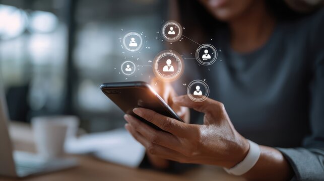 The smartphone in hands connecting virtual social network icons for business communication