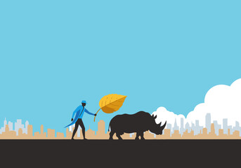 A stylized illustration depicts a man pushing a rhino with a leaf, set against a cityscape.  ?Urban Rhinoceros Peace Offer? ? a bold, modern graphic. © Vector Holiday