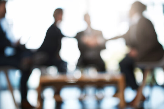 Business, people and handshake in blur meeting for hiring offer, onboarding or welcome to agency. Interview panel, HR managers and shaking hands with applicant for recruitment, contract deal or bokeh
