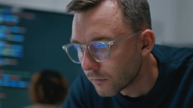 Focused professional software engineer working on laptop and agentic terminal coding in a modern office. Concept of SaaS,agentic workflow,enterprise software development and reinventing tech.