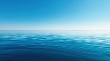 Obraz premium The ocean horizon stretching across a tranquil blue seascape under a clear sky