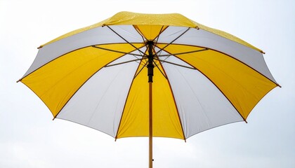 Obraz premium Yellow and White Umbrella Against a Cloudy Sky Perfect for Protection and Shelter from Weather Elements.