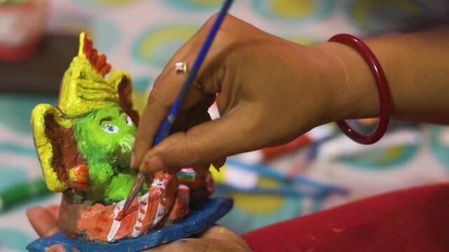 Artist Hand Painting Handmade Lord Ganesha Idol for Ganesh Chaturthi Festival