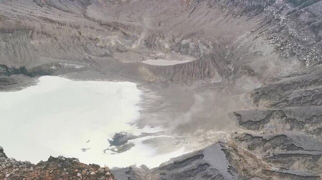 Captivating video of volcanic activity showing steam and gas emissions from Ratu Crater. Located at Tangkuban Perahu, a popular destination near Bandung, Indonesia.