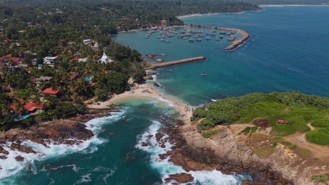 Cinematic footage of fishing village marina along the South coast
