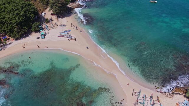 Cinematic drone pan around the iconic Blue Beach in Hiriketiya Sri Lanka