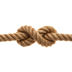 Close up of thick rope tied in a nautical knot on black