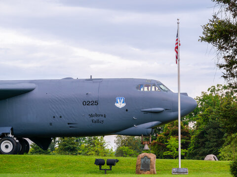 Rome, New York - AUG 7, 2019: B‑52 Memorial Park in Rome, New York, featuring a preserved Boeing B‑52 Stratofortress displayed with unit insignia, dedication plaque, and the American flag. 