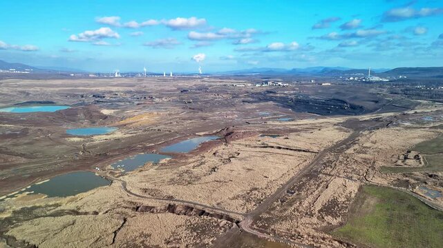 Aerial drone panorama of open mining quarry landscape