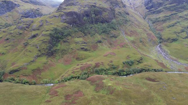 Awesome drone video filming the three sisters of Glencoe and its valley, Scotland, during a lovely fall day.