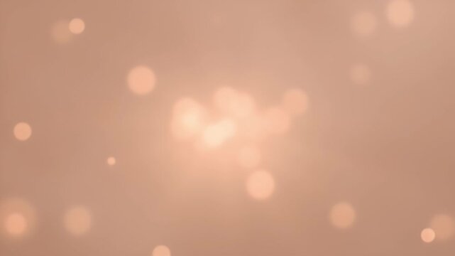Abstract background with blurry lights against a peach color gradient backdrop