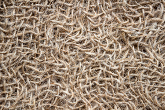 Natural gray coarse linen fabric texture background. Sustainable textile with organic fibers and rustic weave. Neutral eco-friendly surface ideal for branding, product mockups, craft and minimal 