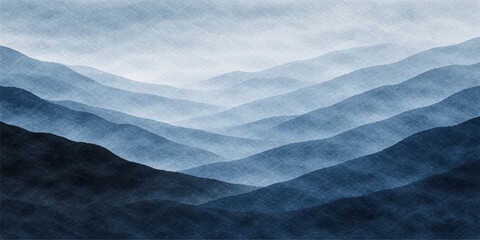 A wide winter landscape of snow covered mountains under a blue sky and clouds with a misty morning fog rising over the cold © MdRifat