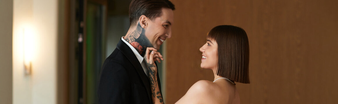 Young couple in love sharing a tender moment at a luxurious hotel