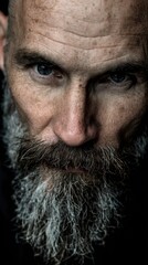 Obraz premium Close-up of a man with a beard and intense gaze