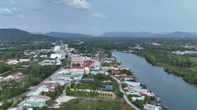 Cua Can, Phu Quoc Island, An Giang (Kien Giang) Province, Southern Vietnam &ndash; 4K aerial drone footage of winding river, coastal houses, fishing boats, village, forest in Gulf of Thailand