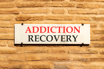Addiction recovery symbol. Concept words Addiction recovery on beautiful big white sign plate....