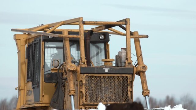 Winter Scene With Rugged Construction Equipment. Industrial Heavy Machinery Amidst Winter Snowscape Details . Stock clip