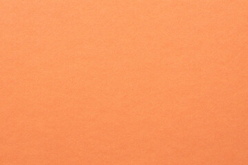 Fototapeta premium Smooth coral peach paper texture background with soft gradient for minimal design