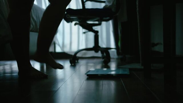 Adult Woman with Overweight Using Floor Scale at Night