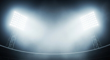 Obraz premium Bright stadium floodlights illuminating a darkened sports arena with a foggy atmosphere, creating a dramatic lighting effect for events