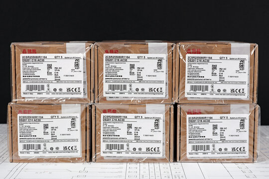 ABB equipment in cardboard packaging on an electronic digram during the assembly of the electrical control panel.