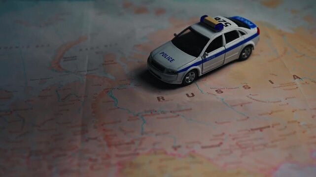 Police car model on map of Russia.