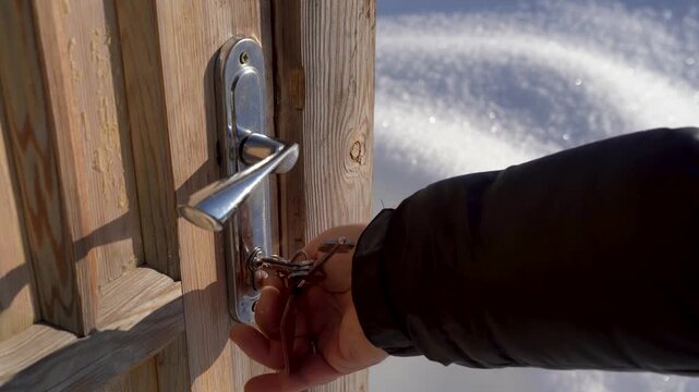 The wooden door is opened from the street with keys