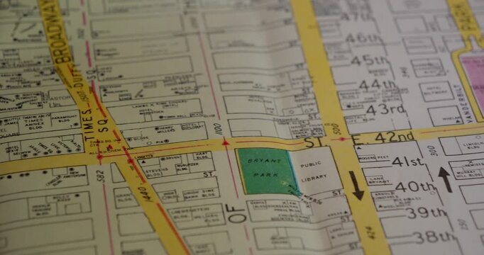 Macro shot of old New York map showing corridor between Times Square and 42nd Street. Ideal for urban travel and navigation themes.