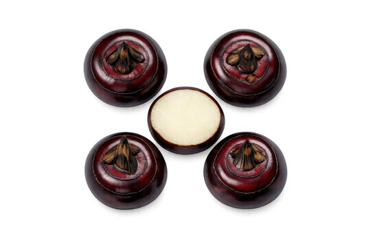 Five whole water chestnuts and one cut in half, showcasing the crisp white interior on black background