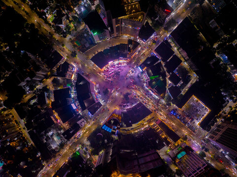 Aerial view of a bustling roundabout illuminated with vibrant lights, capturing the city's energy at night, Dhaka, Dhaka Division, Bangladesh.