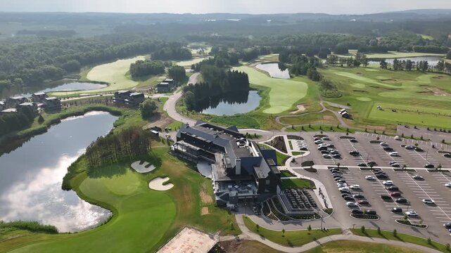 Aerial Tracking Shot Of TPC Toronto At Osprey Valley Golf Course Clubhouse At Sunrise In Alton, Caledon, Canada.