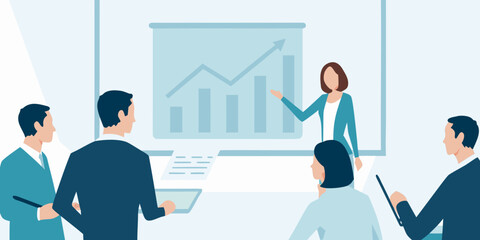 Business presentation with a female speaker and attentive audience members