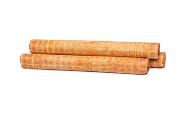 Crispy waffle tubes with sweet filling isolated on white background